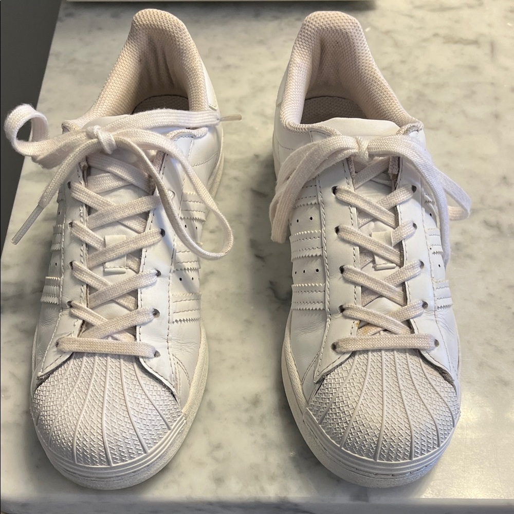 Ladies, white Adidas athletic shoes… would fit size 7 1/2 to 8 1/2